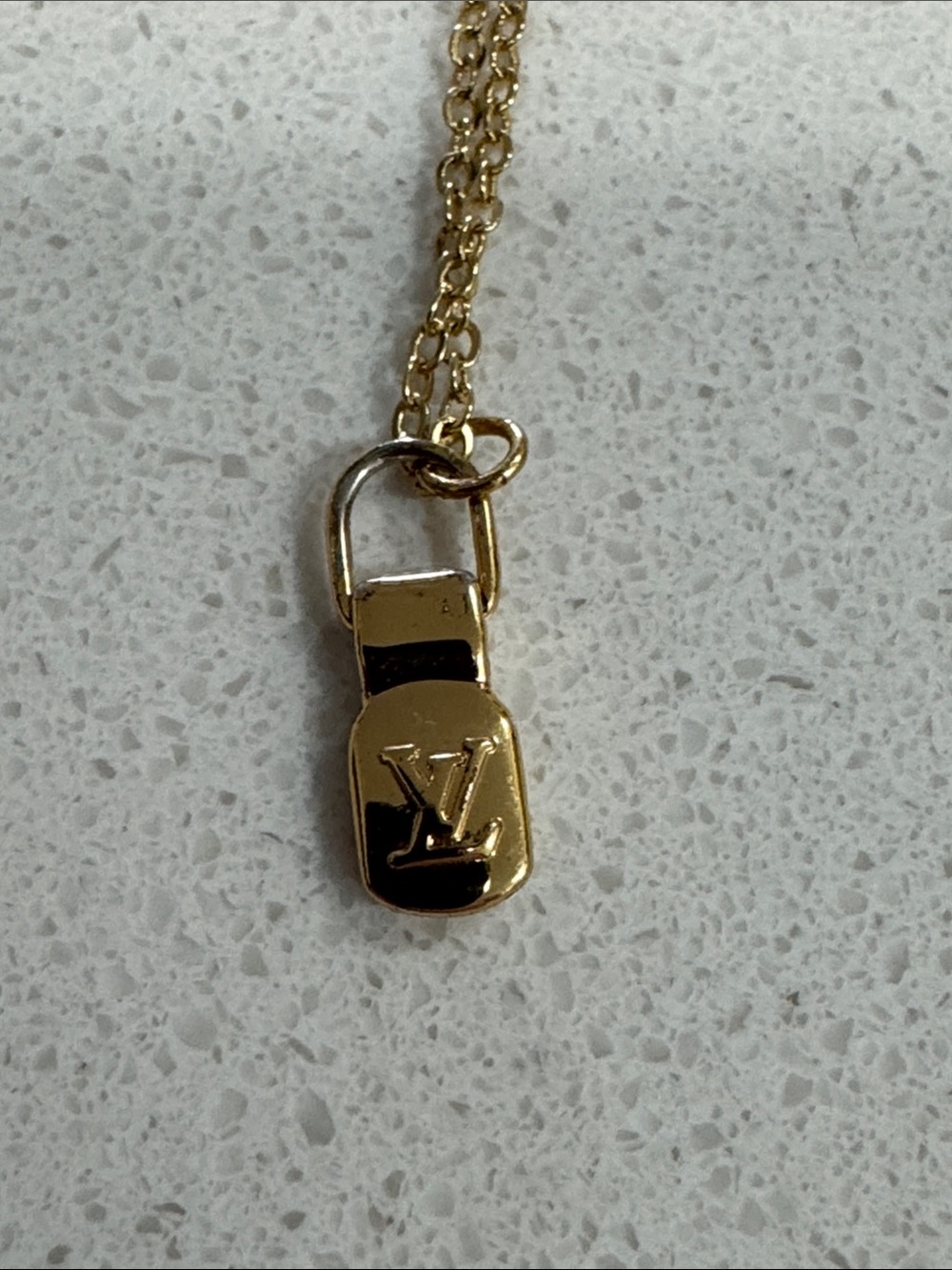 Gold tone LV logo long necklace